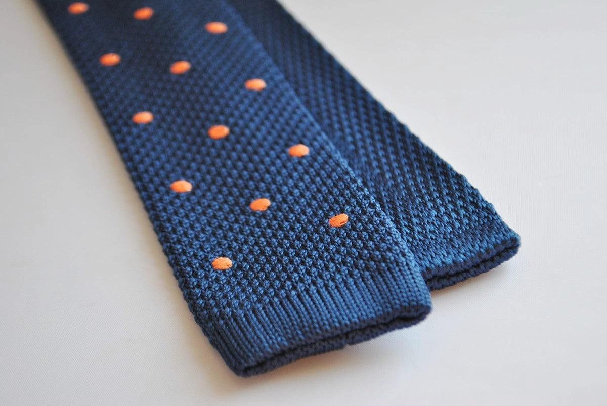 navy blue skinny knitted tie with orange polka dots by Frederick Thomas Handmade Mens Ties