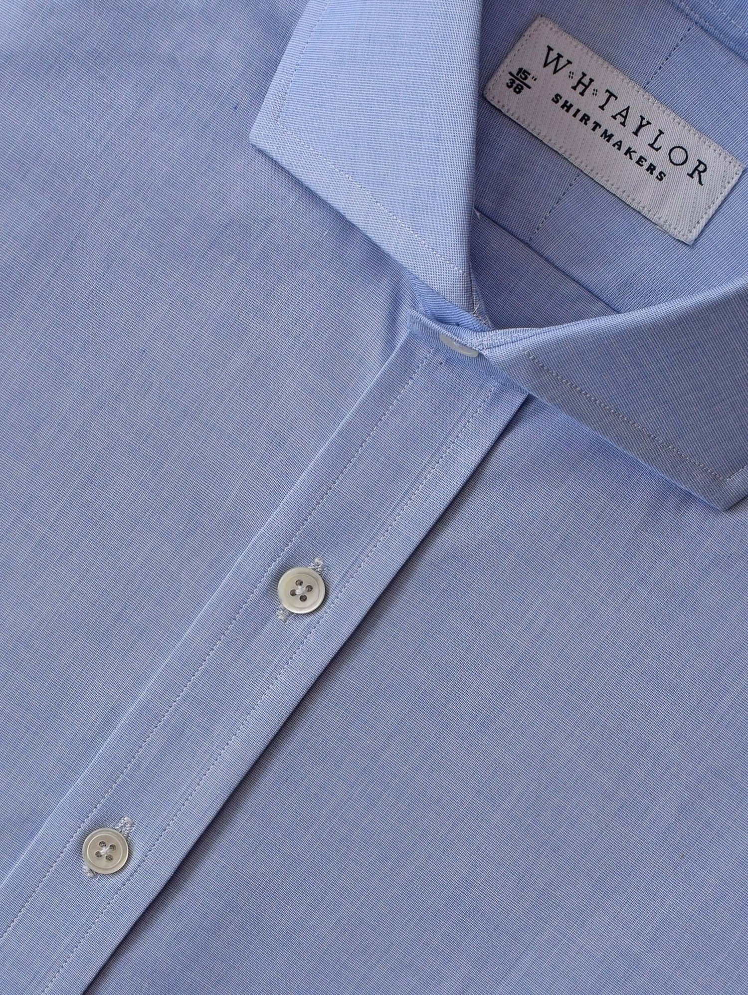 Light blue end on end fine cotton shirt with white buttons, featuring a WH Taylor label, showcasing bespoke, made to order 100% cotton craftsmanship.