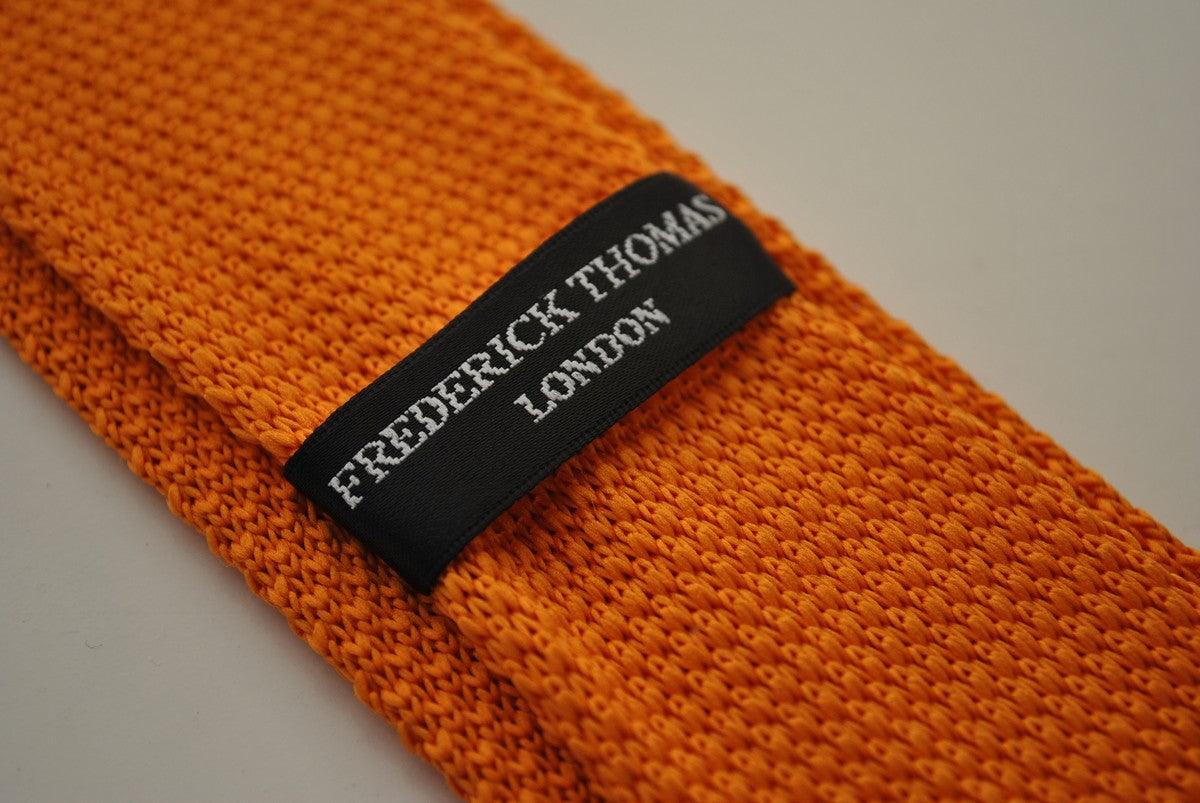 knitted orange tie with royal blue polka dots by Frederick Thomas Handmade Mens Ties