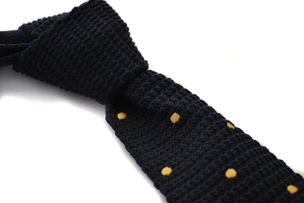 navy blue skinny knitted tie with gold polka dots by Frederick Thomas Handmade Mens Ties