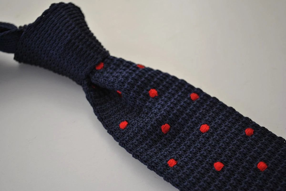 navy blue skinny knitted tie with red polka dots design by Frederick Thomas Handmade Mens Ties
