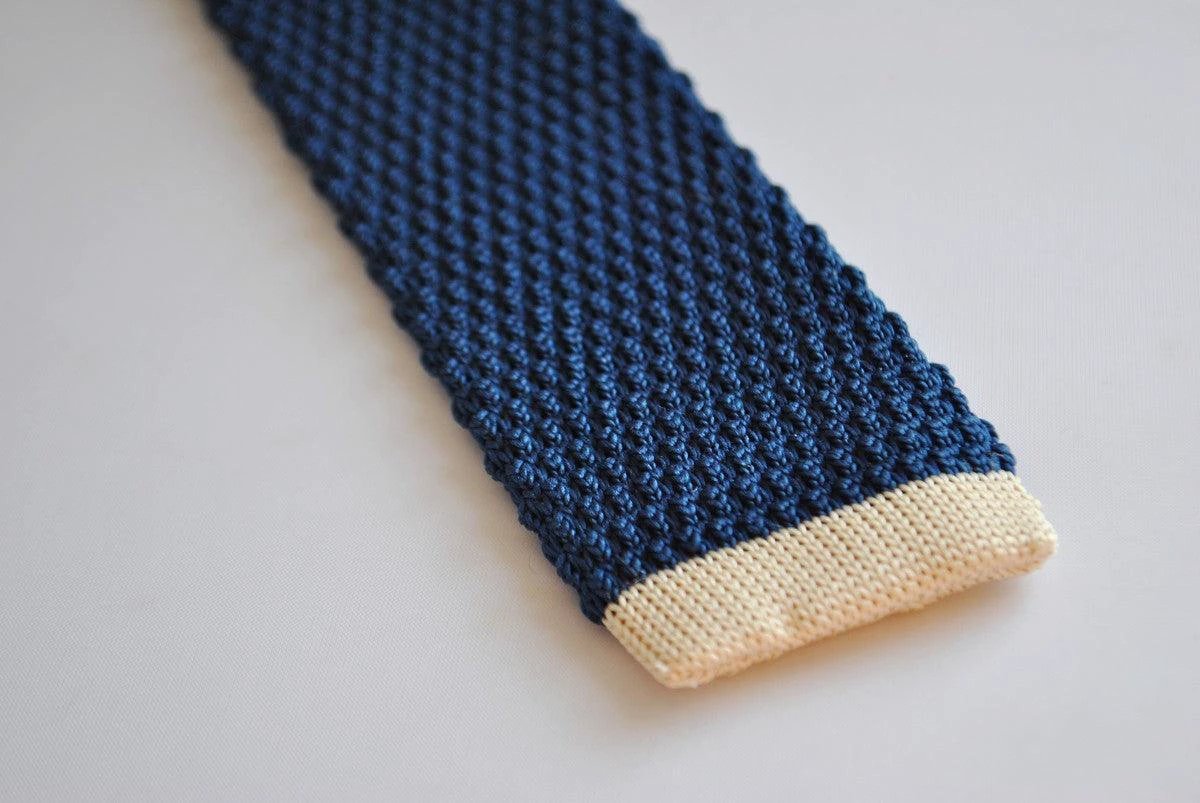 navy blue skinny knitted tie with cream tip by Frederick Thomas Handmade Mens Ties