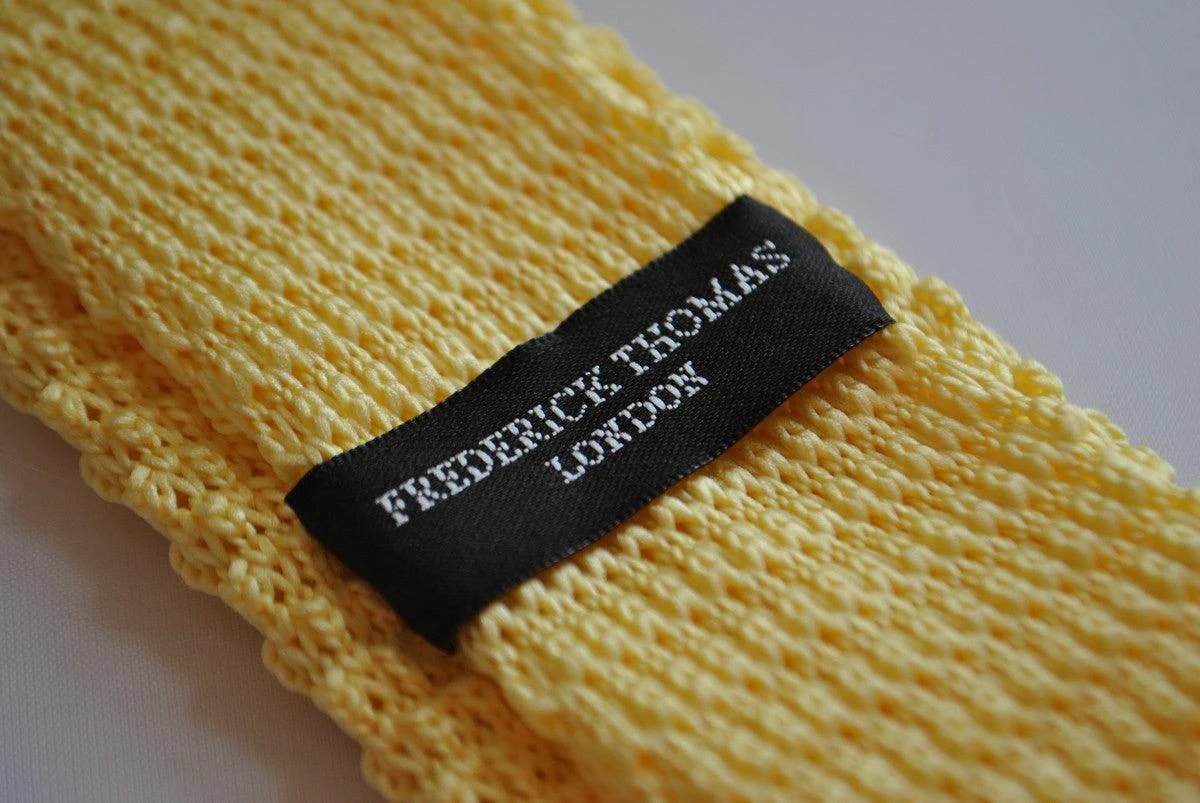 lemon yellow skinny knitted tie with navy blue tip by Frederick Thomas Handmade Mens Ties