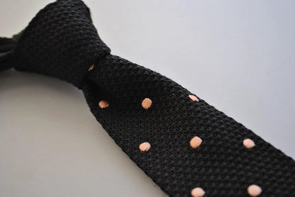 black skinny knitted tie with light blush pink polka dots by Frederick Thomas Handmade Mens Ties