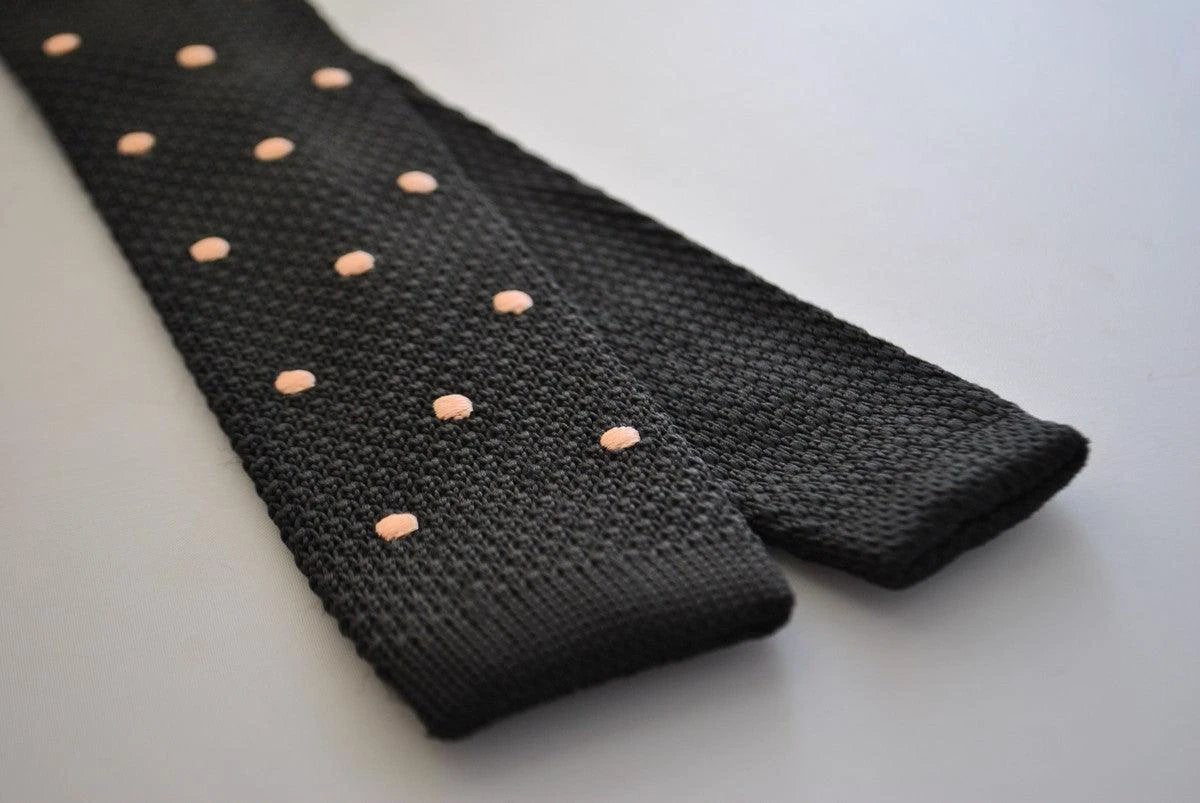 black skinny knitted tie with light blush pink polka dots by Frederick Thomas Handmade Mens Ties