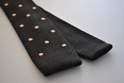 black skinny knitted tie with light blush pink polka dots by Frederick Thomas Handmade Mens Ties
