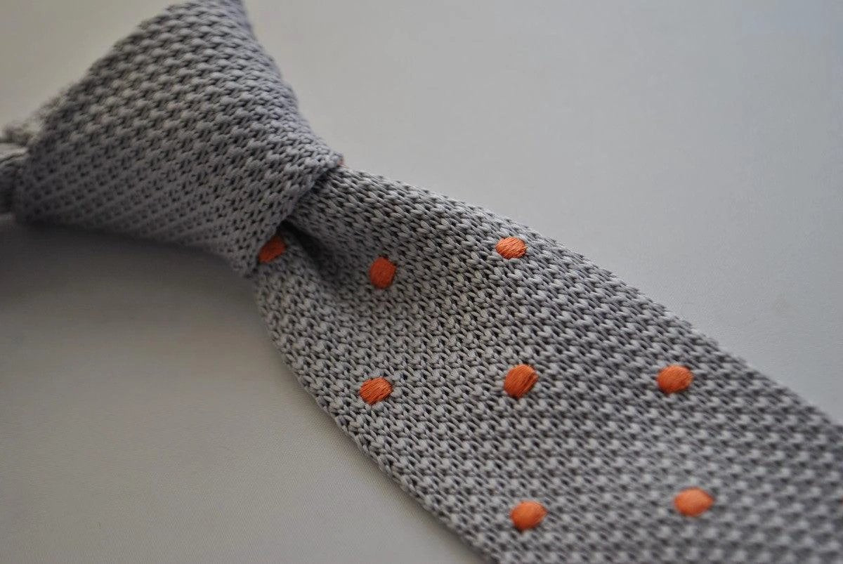 grey skinny knitted tie with orange polka dots by Frederick Thomas Handmade Mens Ties