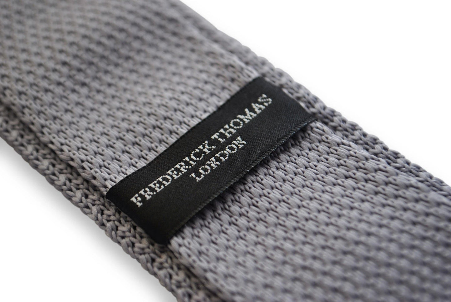 grey skinny knitted tie with pink polka dots by Frederick Thomas Handmade Mens Ties