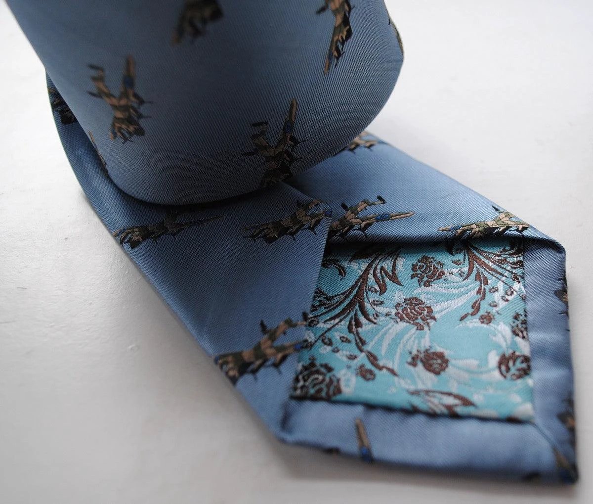 light blue tie with lancaster bomber pattern by Frederick Thomas Handmade Mens Ties