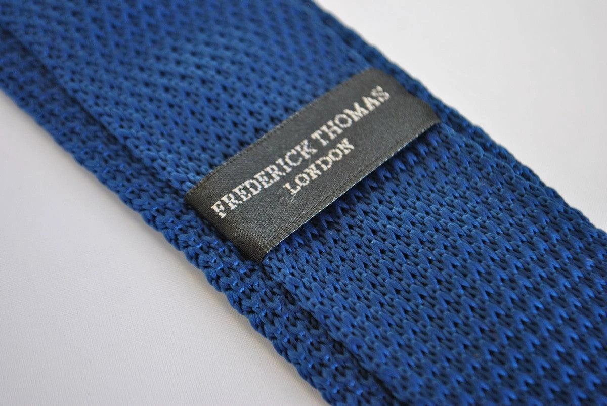 navy blue skinny knitted tie with brown polka dots by Frederick Thomas Handmade Mens Ties