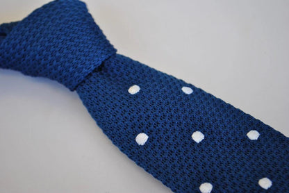 navy blue skinny knitted tie with white polka dots and pointed end by Frederick Thomas Handmade Mens Ties