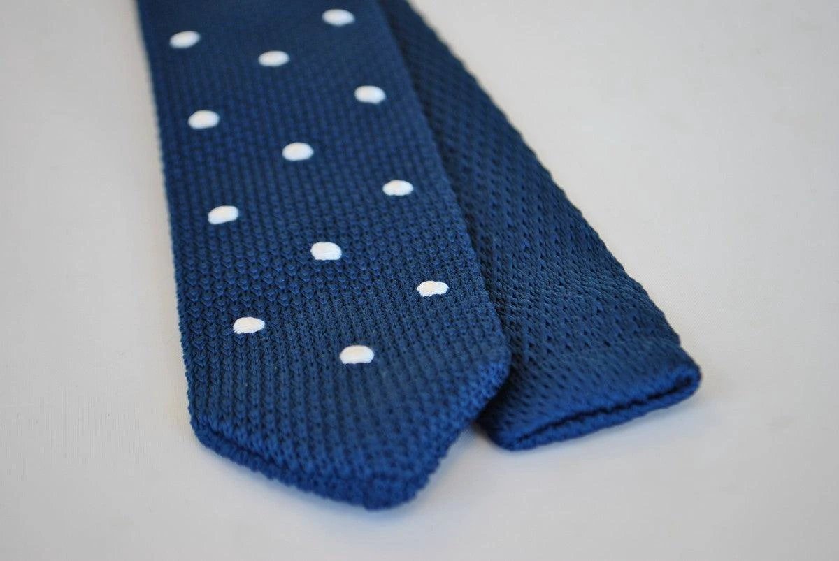 navy blue skinny knitted tie with white polka dots and pointed end by Frederick Thomas Handmade Mens Ties