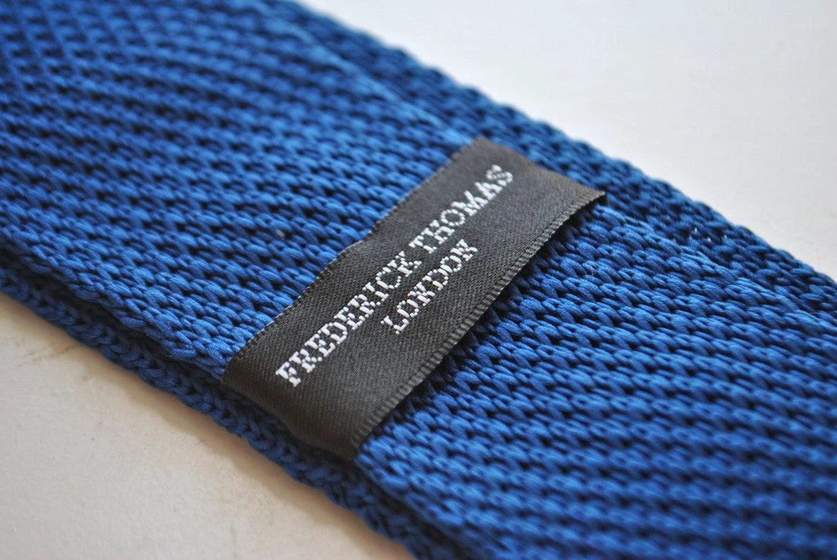 navy blue skinny knitted tie with powder pink polka dots by Frederick Thomas Handmade Mens Ties